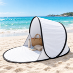 White pop-up beach shelter on a white sand beach