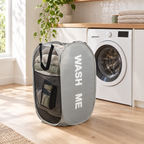 Grey pop-up laundry hamper in a bright modern laundry