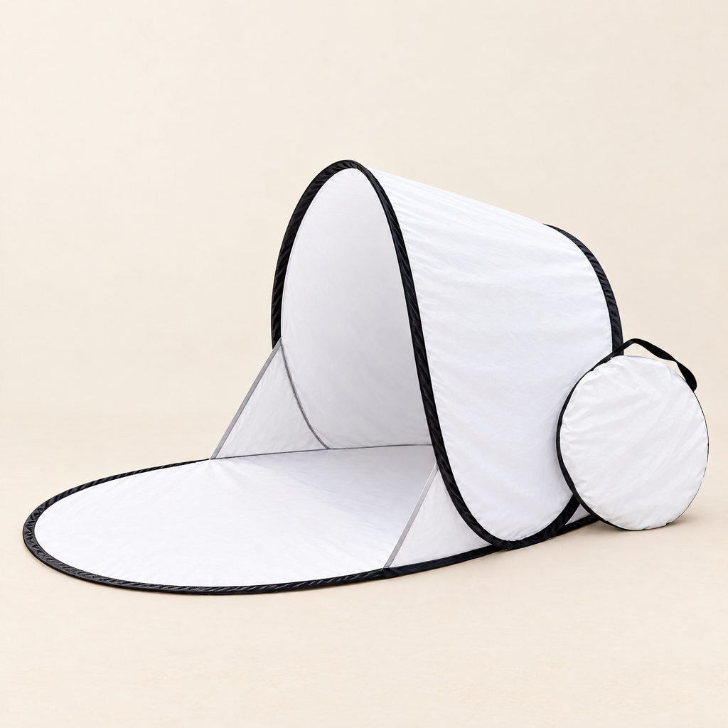 White pop-up beach shelter with its round carry bag